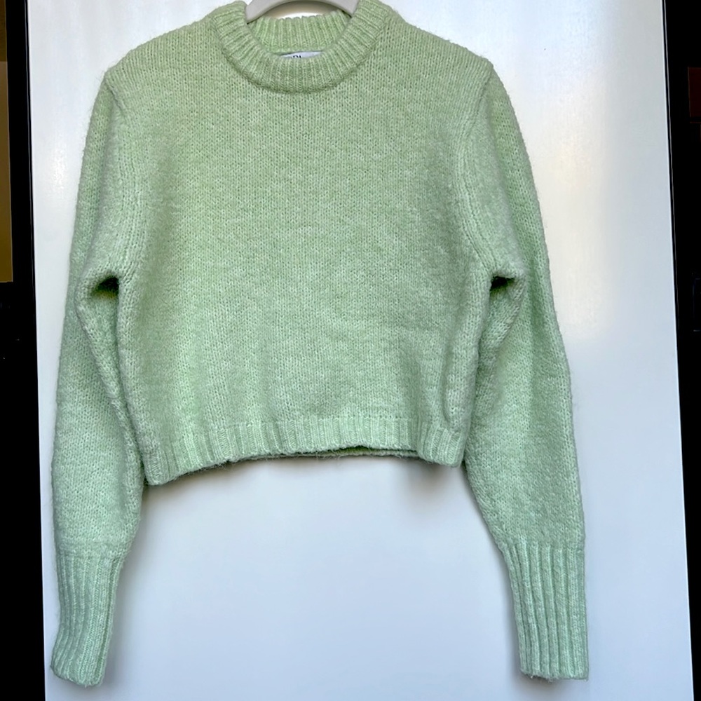 Soft cropped knit sweater.